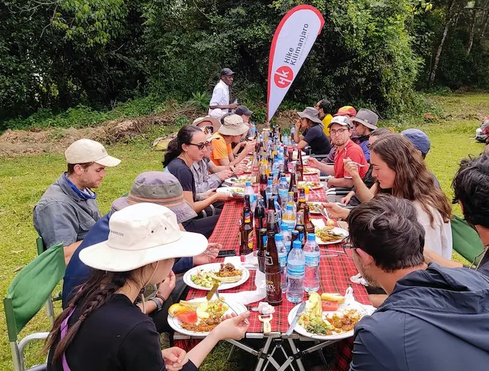 Group having lunch at the gate during 7-Day Kilimanjaro Group Join Trek - Machame Route