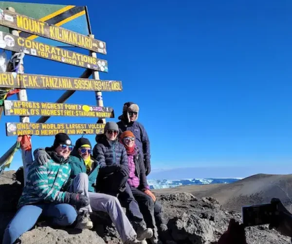 A group at Uhuru peak during Kilimanjaro Machame Route hike - 6 Days