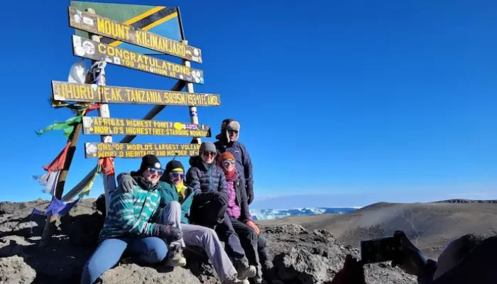 A group at Uhuru peak during Kilimanjaro Machame Route hike - 6 Days
