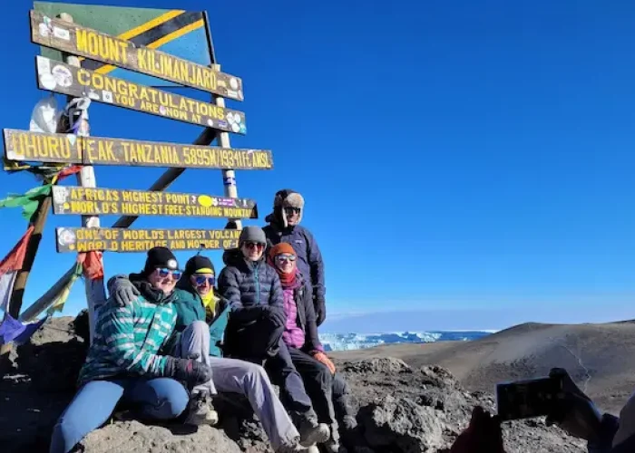 A group at Uhuru peak during Kilimanjaro Machame Route hike - 6 Days