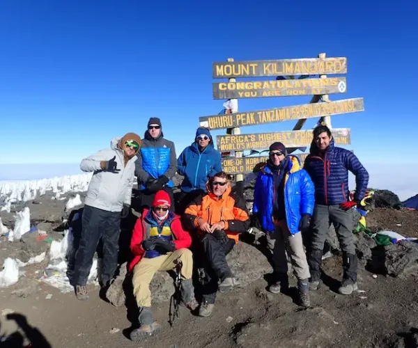 the group at uhuru peak during Kilimanjaro Rongai Route Trek - 6 Days