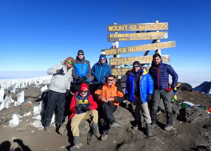 the group at uhuru peak during Kilimanjaro Rongai Route Trek - 6 Days