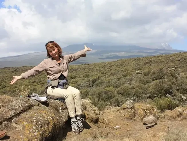 Woman resting on the Shira Plateau during a Kilimanjaro day hike