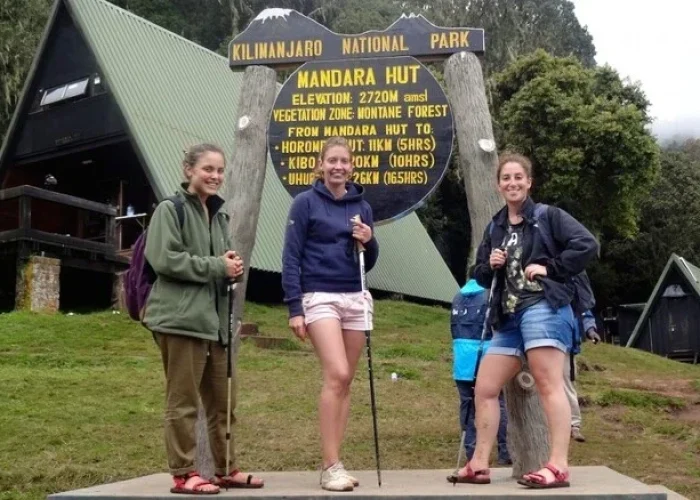 Girls posing at Mandara Hut on the Kilimanjaro day hike via the Marangu Route
