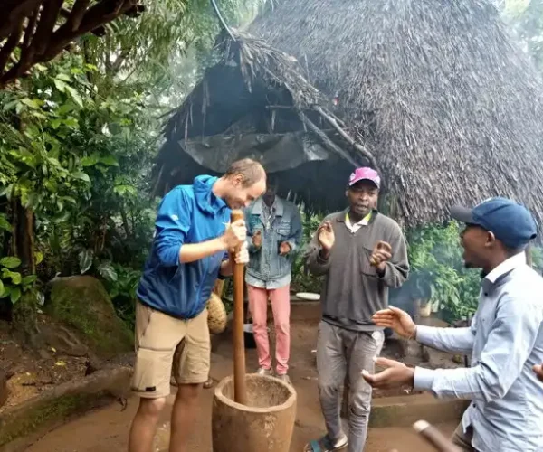 ChatGPT said: Clients experiencing traditional coffee making in Materuni Village on the Materuni Waterfalls & Coffee Tour cultural day trip from Arusha