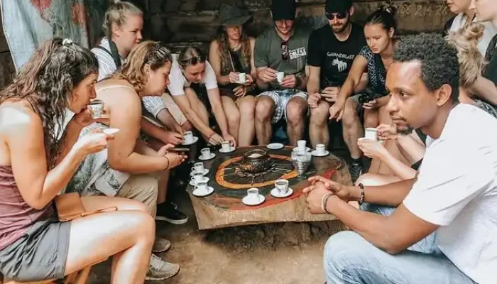 Clients tasting freshly brewed local coffee in Materuni Village on the Materuni Waterfalls & Coffee Tour – Cultural Day Trip from Arusha