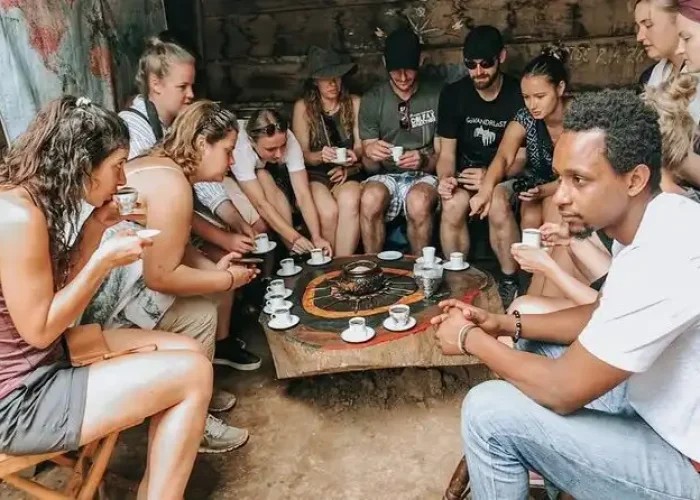 Clients tasting freshly brewed local coffee in Materuni Village on the Materuni Waterfalls & Coffee Tour – Cultural Day Trip from Arusha